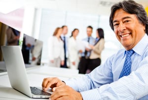 Corporate business worker at the office with a laptop