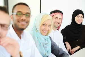 Happy smiling business people sitting in a row