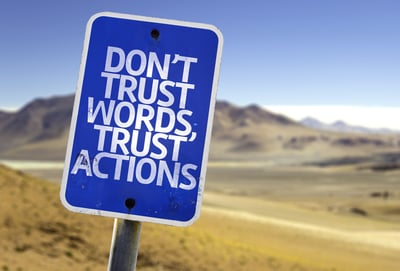 Don't Trust Words, Trust Actions sign - Lone Armadillo