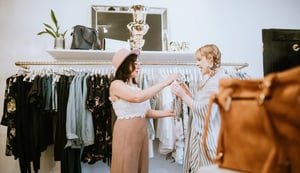 Latina helping a clothes shopper