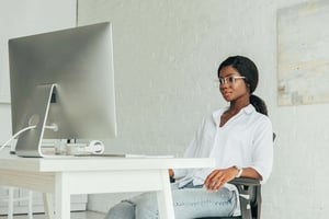 Young attractive black female at computer